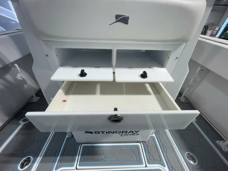 Slide: The Image of Tackle Storage Drawers and Rigging Station on Fishing Boat Close-up of built-in tackle storage compartments under the leaning post. Multiple drawers and organized rigging space ideal for serious anglers. - 5799735