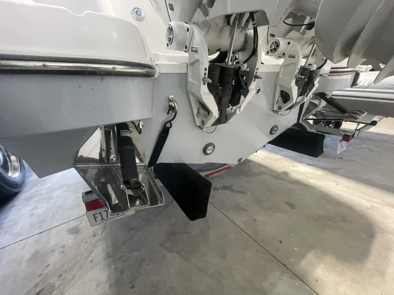 Slide: The Image of Trim Tabs and Transom Hardware – Stingray Boat Underside View Underside rear view highlighting trim tabs, outboard mounts, and transom components—useful for buyers evaluating condition and marine hardware. - 5799741