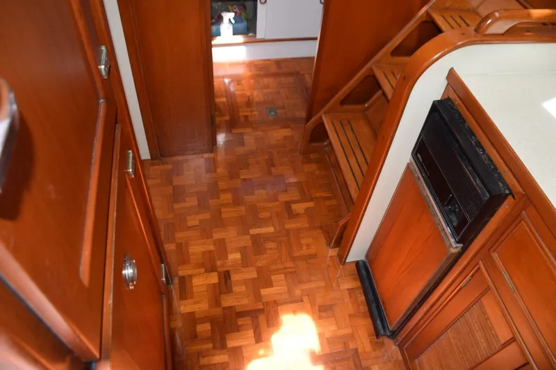 Slide: The Image of Teak parquet sole and trash compactor in galley - 5805837