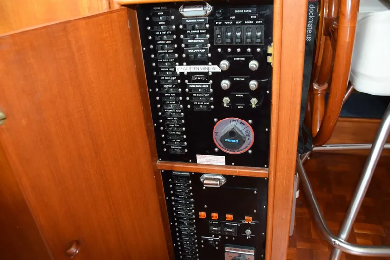 Slide: The Image of Main electrical breaker panel is to the inboard side of the lower helm - 5805856