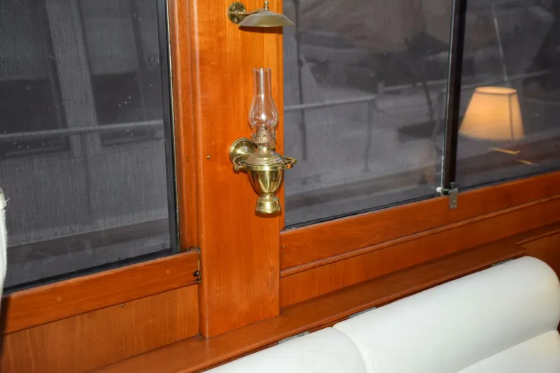Slide: The Image of Interior of 1997 Grand Banks Classic with brass oil lamp and opening side window - 5805868