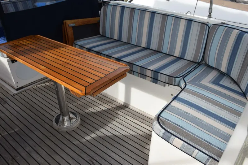 Slide: The Image of Flybridge aft, new cushions, refinished teak table, original teak decking still remains on flybridge - 5805817