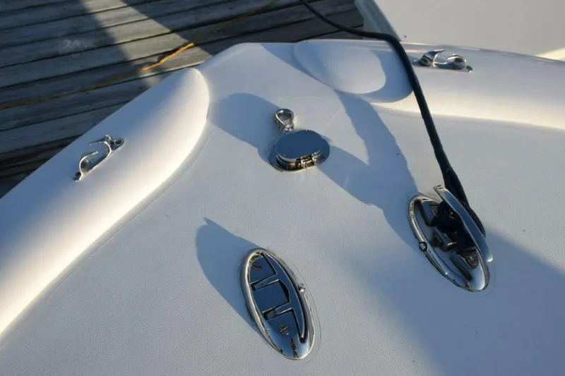 Slide: The Image of Bow And Midship Pop Up Cleats. Anchor Rode In Hawser   Anchor Stored Under Forward Bench Seat On Bridge Deck - 5806569