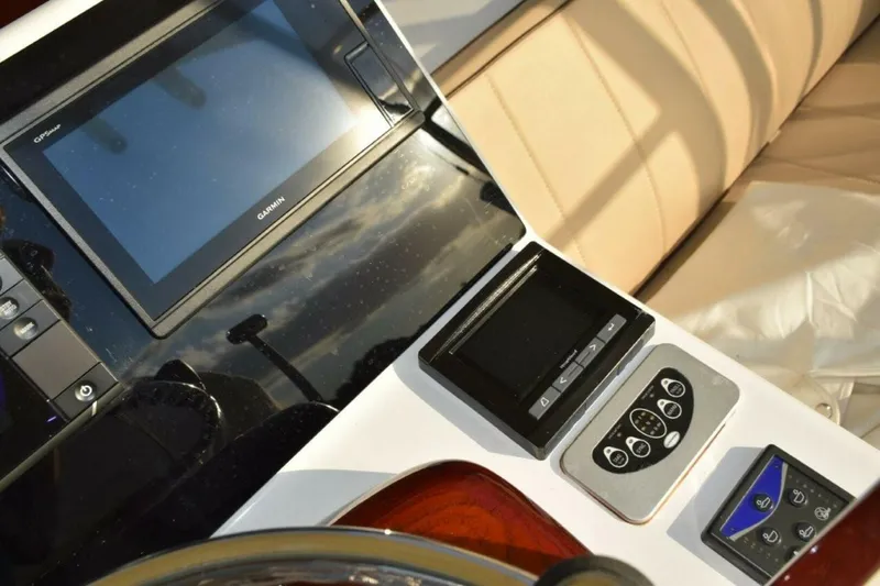 Slide: The Image of Garmin Display, Cummins Smartcraft Digital Engine Display, Glendinning Electric Engine Control Selector Panel And Trim Tabs Controller - 5806580