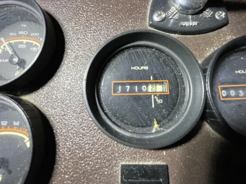 Slide: The Image of Engine Hour Meter Showing 1702 Hours – Egg Harbor 40 Close-up of the hour meter indicating 1,702 original hours on the Crusader engines—excellent for a freshwater vessel. - 5808857