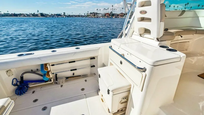 Slide: The Image of Spacious Aft Deck with Seating The aft deck of the 2008 Boston Whaler 34 Outrage offers a spacious and functional area perfect for fishing or relaxing. Featuring a built-in cooler and ample storage compartments, this area is designed for convenience and comfort. The clean, white finish - 7672506