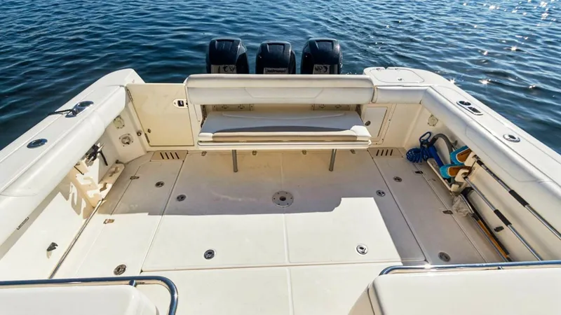 Slide: The Image of Spacious Aft Deck with Seating This inviting aft deck on the 2008 Boston Whaler 34 Outrage features ample seating and a clean, open layout ideal for socializing or fishing. The sturdy bench seat provides comfort while allowing easy access to the water with the adjacent swim platform. T - 7672507