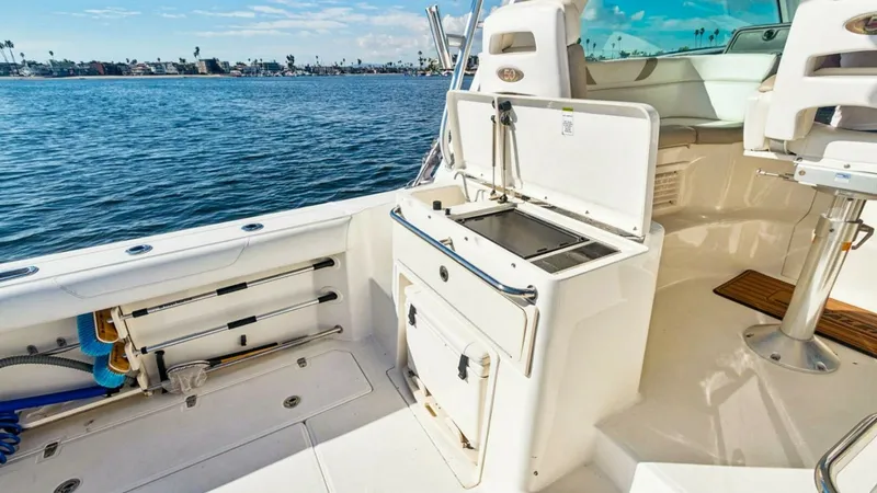 Slide: The Image of Cockpit with Bait Prep Station The cockpit of the 2008 Boston Whaler 34 Outrage features a versatile bait prep station, ideal for fishing enthusiasts. Equipped with ample storage and practical work surfaces, it offers convenience and functionality. The surrounding seating and clean des - 7672504