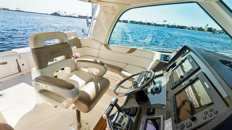 Slide: The Image of Helm Station with Dual Seating The helm station of the 2008 Boston Whaler 34 Outrage features a state-of-the-art control console with dual multifunction displays, providing comprehensive navigation capabilities. The ergonomic captain's chairs offer both comfort and style, with a view o - 7672502