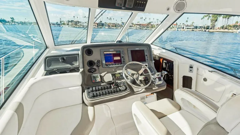 Slide: The Image of Helm Station with Electronics The helm station of the 2008 Boston Whaler 34 Outrage features a modern console with state-of-the-art electronics, offering precise navigation and control. The plush helm seat ensures comfort during long voyages, while expansive windows provide excellent - 7672500