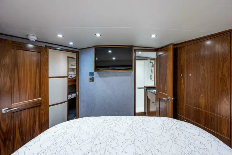 Slide: The Image of Viking 68 KEMOSABE - Master Stateroom TV 2022 Viking 68 Convertible KEMOSABE - 5845907
