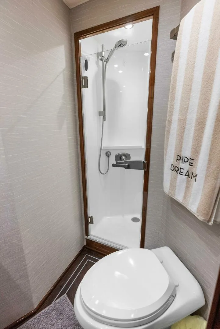 Slide: The Image of 2022 Viking 68 Enclosed Bridge- PIPE DREAM- Forward Stateroom Head - 5922364