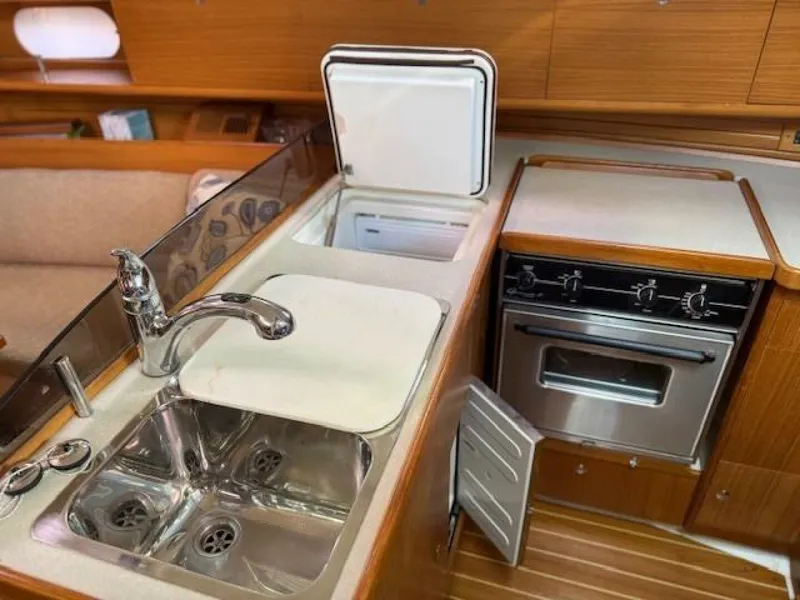 Slide: The Image of Galley with top and bottom fridge/freezer doors open 35' Catalina 355, Island Time II - 5875270