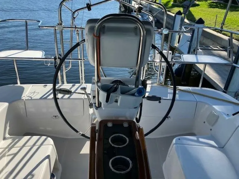 Slide: The Image of Walk-thru transom with wheel folded 35' Catalina 355, Island Time II - 5875282