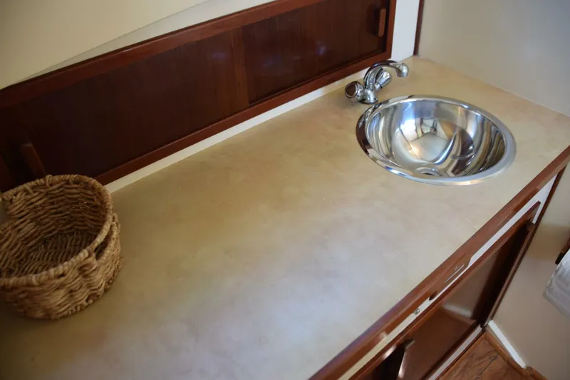 Slide: The Image of Storage Cabinet With Sliding Door Behind Countertop - 5911873