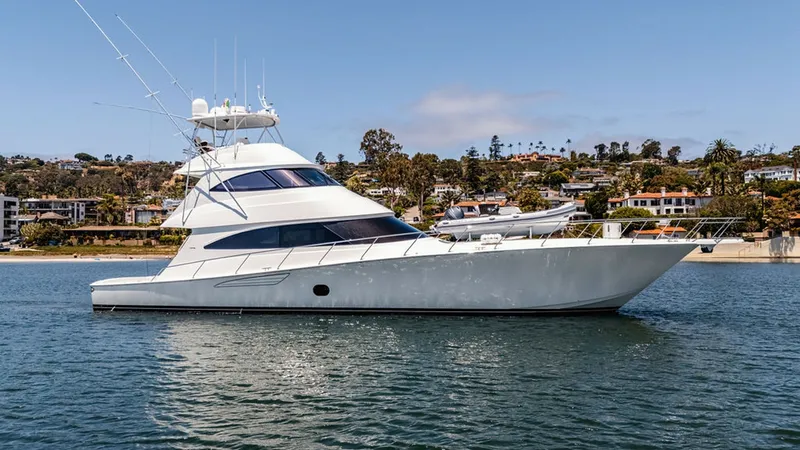 Slide: The Image of Starboard Profile of Viking 80 Skybridge This image showcases the sleek starboard profile of the 2019 Viking 80 Skybridge, 'PARTY OF FIVE.' The yacht's elegant lines and spacious skybridge are highlighted, emphasizing its luxurious design and superior craftsmanship. The expansive windows offer p - 6478771