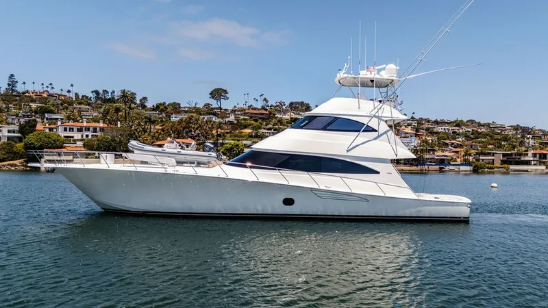 Slide: The Image of Side Profile of Skybridge Yacht This image showcases the sleek side profile of the 2019 Viking 80 Skybridge, 'PARTY OF FIVE'. The yacht's elegant lines and spacious deck are highlighted, with the distinctive skybridge enhancing its luxurious design. The expansive windows provide panoram - 6478777