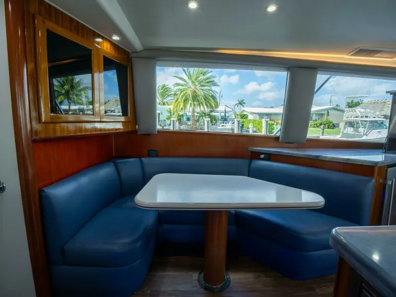 Slide: The Image of Viking 58 BAREFOOT - Salon/Galley Dinette 1998 Viking 58 Convertible BAREFOOT - 7676783