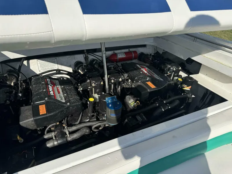 Slide: The Image of Twin MerCruiser 454 MAG MPI Engines Engine bay showing twin MerCruiser 454 MAG MPI big-block engines and Bravo drives powering this 1999 Formula 312 FASTech. - 5945908