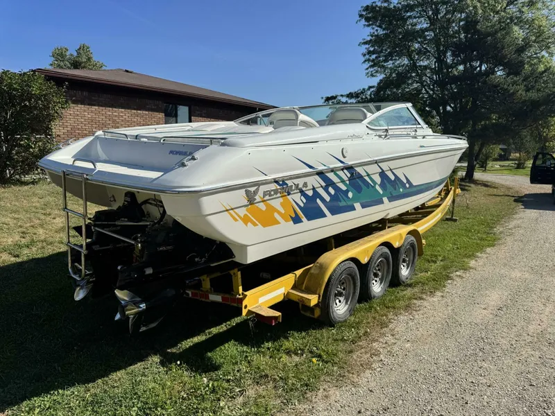 Slide: The Image of Formula 312 FASTech Stern and Bravo Drives Rear view of 1999 Formula 312 FASTech showing twin Bravo One stern drives, swim ladder, and performance offshore transom layout. - 5945915