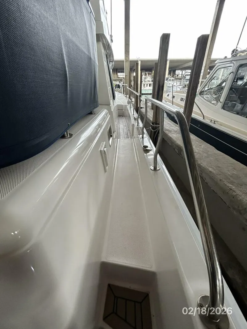 Slide: The Image of 43' Mainship starboard side deck2 - 5961288