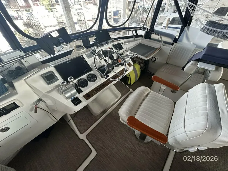 Slide: The Image of 43' Mainship flybridge helm1 - 5961191