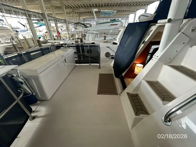 Slide: The Image of 43' Mainship trunk cabin port - 5961298