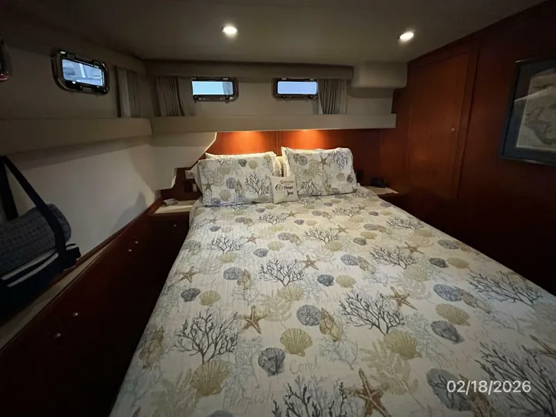 Slide: The Image of 43' Mainship master stateroom port - 5961264