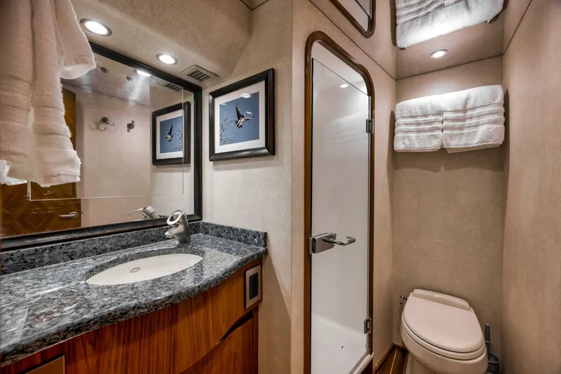 Slide: The Image of 2011 Viking 76 Enclosed Bridge- TEUSEAS- MAster Stateroom Head - 5966537