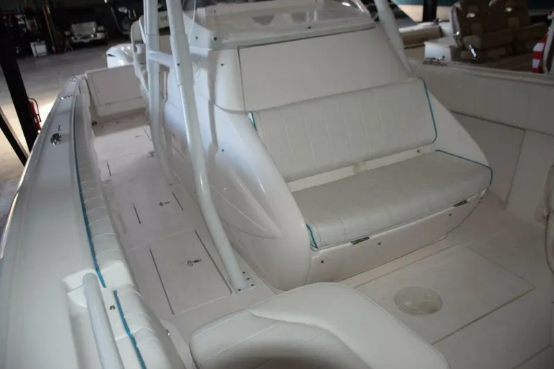 Slide: The Image of Seat On Front Of Console With Built In Cooler Beneath Seat. - 5972604