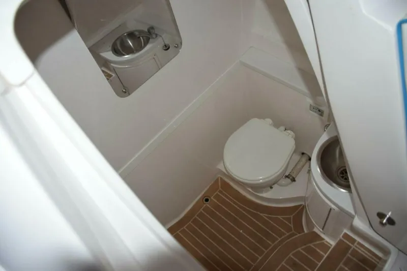 Slide: The Image of Raritan Electric Head, Stainless Steel Sink With Faucet, Shower Wand, And Drained Sole With SeaDek, Mirror. - 5972606