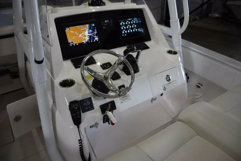 Slide: The Image of 2017 Intrepid 327 Open Boat Dashboard With Steering Wheel And Navigation Screens. - 5972597