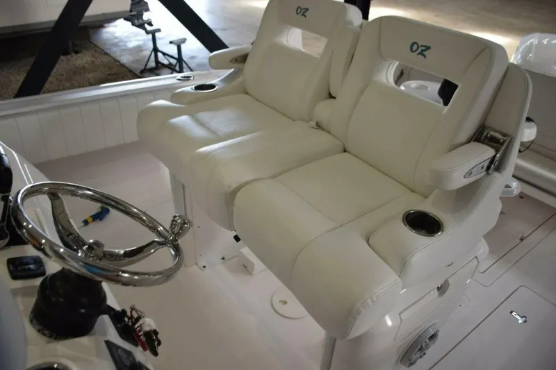 Slide: The Image of Ocean Elite Helm Seat Console With Fold Down Armrests And Drink Holders. - 5972598