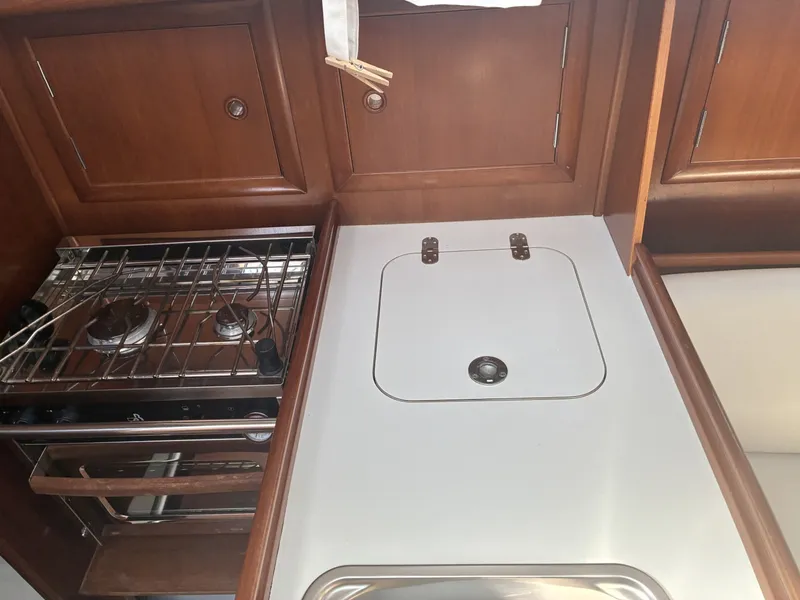 Slide: The Image of 2003 Beneteau Oceanis 311 - Countertop Galley countertop storage and stove and oven - 5999390