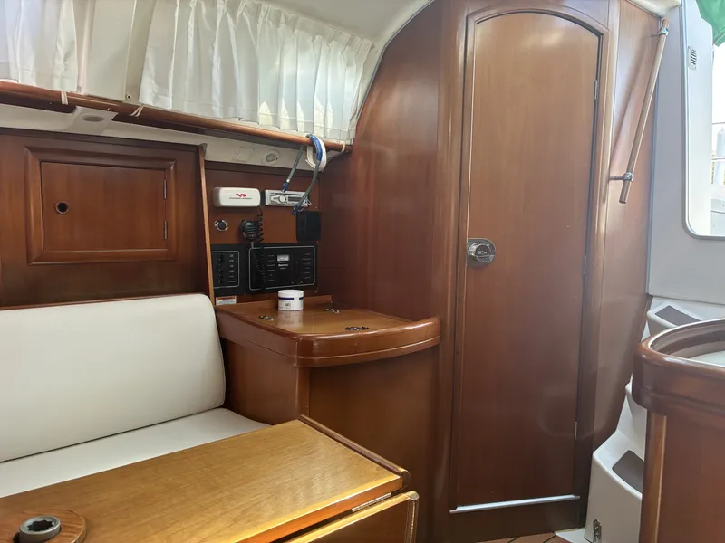 Slide: The Image of 2003 Beneteau Oceanis 311 - Head door Looking aft at NAV station and head door - 5999393