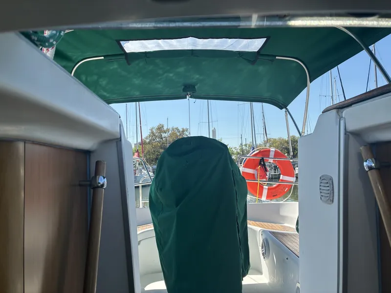 Slide: The Image of 2003 Beneteau Oceanis 311 - Helm cover Looking aft into cockpit, helm station cover and Bimini - 5999387