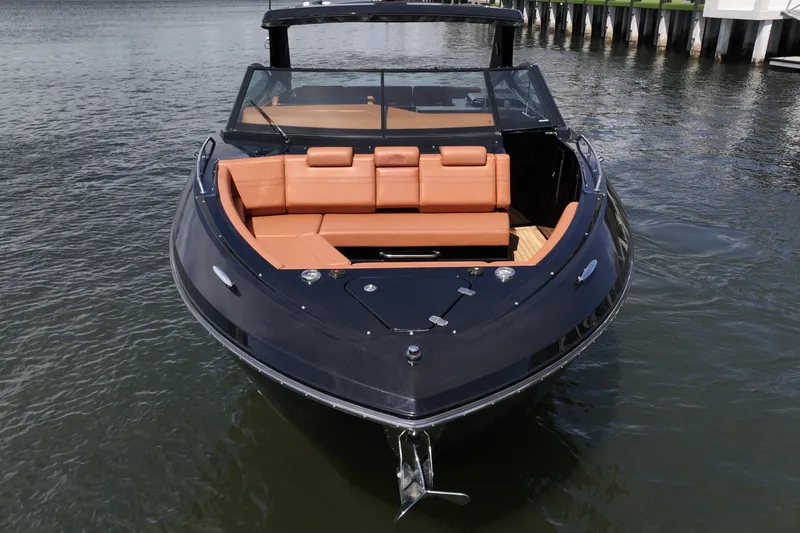 Slide: The Image of Bow Lounge Seating, Cruisers Yachts 38 GLS The bow of the Cruisers Yachts 38 GLS is configured with a deep, wraparound lounge finished in rich tan upholstery, providing a comfortable and social forward seating area. Adjustable backrests allow for both upright seating and relaxed lounging, making t - 6003067