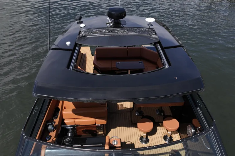 Slide: The Image of Hardtop with Retractable Sunroof, Cruisers Yachts 38 GLS The hardtop is designed with a retractable sunroof, allowing the cockpit to transition between full shade and open-air exposure. When closed, it provides protection from the elements, and when retracted, it enhances airflow and natural light throughout th - 6003112