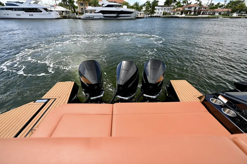 Slide: The Image of Triple Mercury Power and Aft Lounge, Cruisers Yachts 38 GLS The stern view highlights the triple Mercury outboard configuration, delivering strong acceleration, responsive handling, and efficient cruising performance. Positioned just forward, the aft sun lounge provides a comfortable vantage point with direct view - 6003069