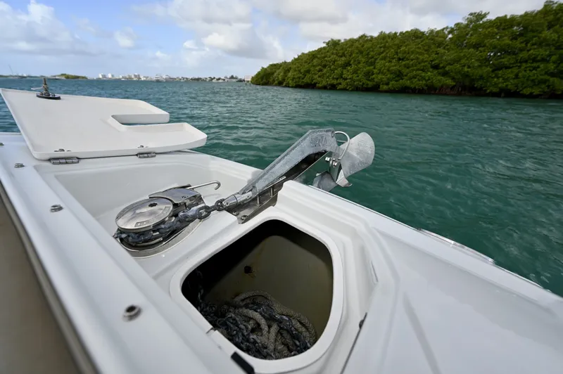 Slide: The Image of Integrated bow anchor system with windlass, stainless anchor, and chain locker. Clean setup allows easy deployment and secure anchoring for sandbar stops or holding position. - 6024949