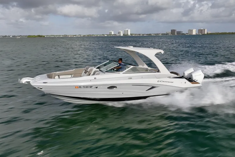 Slide: The Image of Crownline E305 XS powered by twin 225hp Mercury outboards. Spacious bow and cockpit seating, hardtop shade, swim platform, and onboard head. Ideal for cruising, sandbar stops, and watersports. Crownline E305 XS powered by twin 225hp Mercury outboards. Spacious bow and cockpit seating, hardtop shade, swim platform, and onboard head. Ideal for cruising, sandbar stops, and watersports. - 6024932
