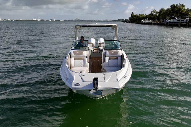 Slide: The Image of Crownline E305 XS Crownline E305 XS with twin 225hp Mercury outboards. Spacious seating, hardtop shade, swim platform, and onboard head. Perfect for cruising, sandbars, and entertaining on the water - 6024935