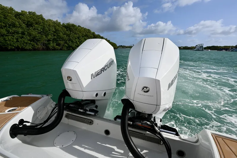 Slide: The Image of Twin Mercury FourStroke outboards deliver smooth, quiet performance with strong acceleration and reliable offshore power. Clean rigging and efficient design support stable cruising and responsive handling. - 6024937