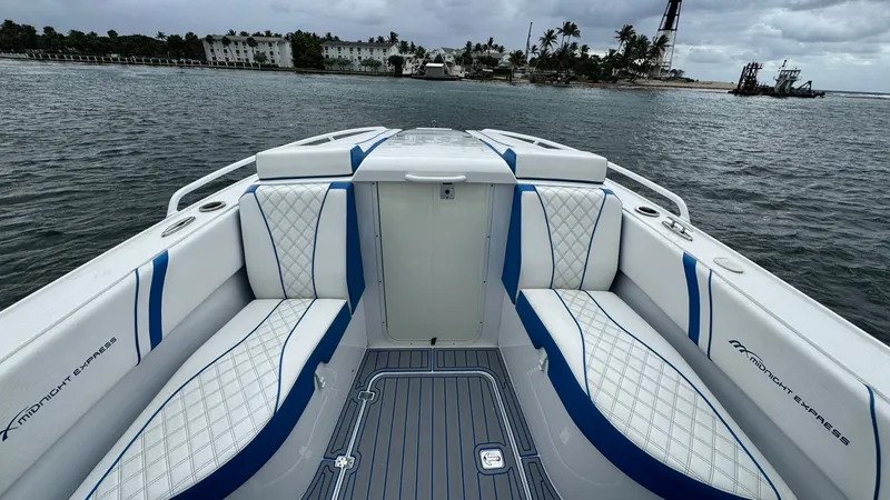 Slide: The Image of Spacious Bow Seating Area The bow of the 2016 Midnight Express 39S Cuddy features luxurious, diamond-stitched seating with sleek blue accents, providing ample space for relaxation. The high-quality upholstery complements the modern design, making it ideal for comfort while cruisin - 6311146