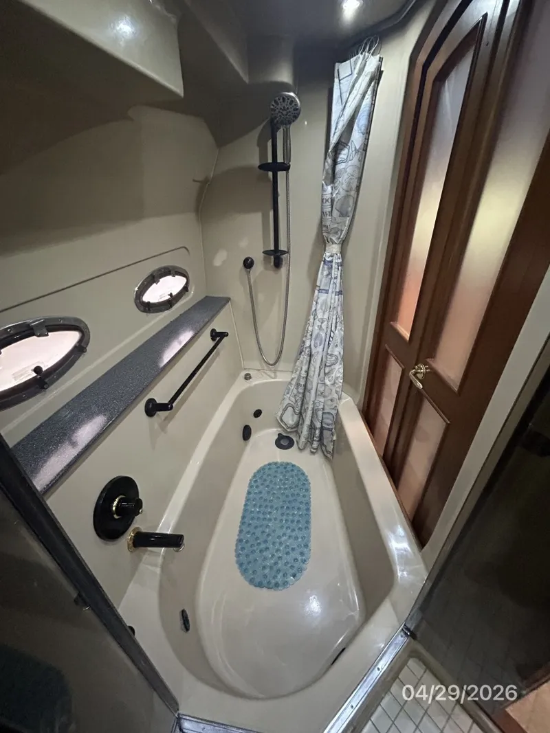 Slide: The Image of 44' Cruisers master stateroom tub-shower1 - 6075648