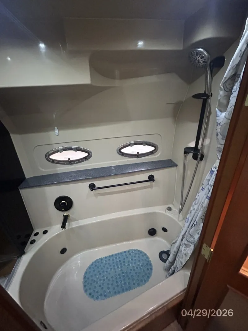 Slide: The Image of 44' Cruisers master stateroom tub-shower2 - 6075647