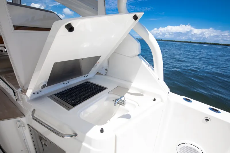 Slide: The Image of Pursuit 37 - Irish Ayes - Cockpit, Grill and Sink 2020 Pursuit DC 365 - Irish Ayes - 7866883