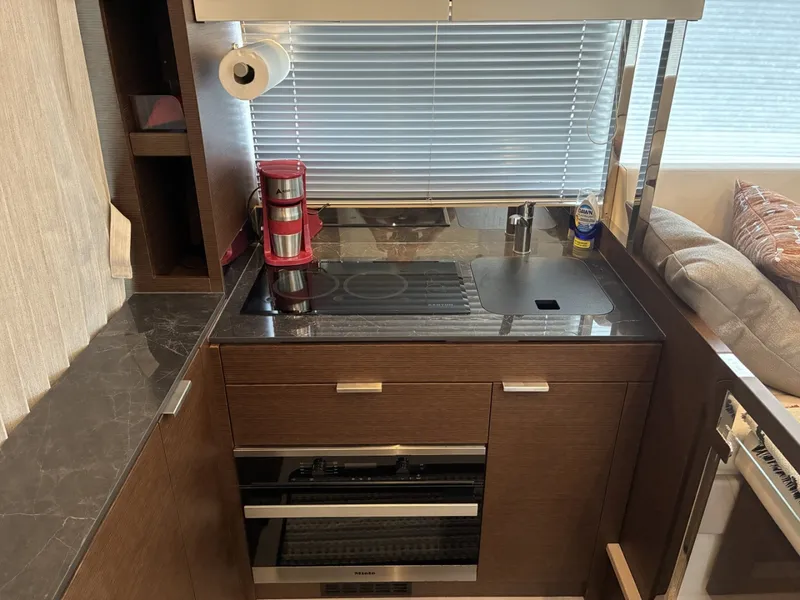 Slide: The Image of 2020 Prestige 420S -  Galley port with stove top and oven - 6081668