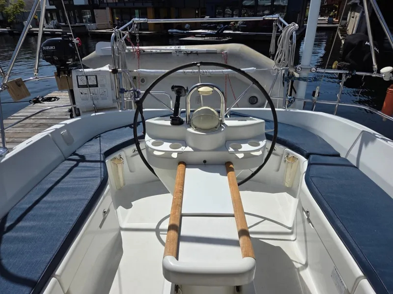 Slide: The Image of Cockpit of a 2000 Beneteau Oceanis 411 sailboat with steering wheel and seating - 6257946
