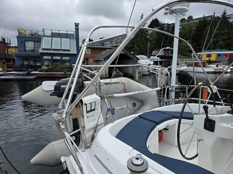 Slide: The Image of Beneteau Oceanis 411 sailboat docked at Signature showing davits and dinghy - 6257926